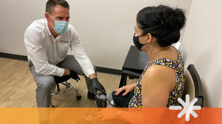 Justin Pfaff, CPO, provides a safe prosthetic consultation to Hanger Clinic patient Yvonne Llanes.